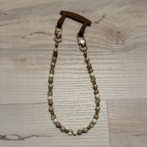 The CAEP beaded phone wristlet